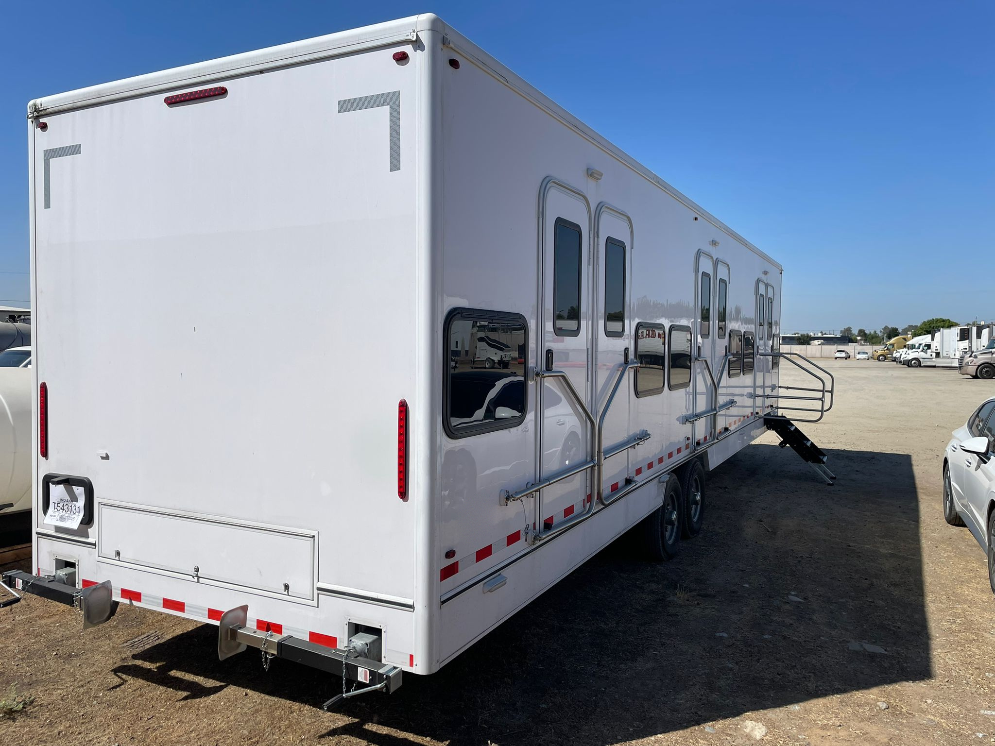 34 ft bunkhouse sleeper trailer with three bunk entry doors and built-in steps