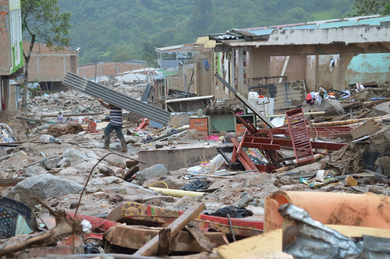 Disaster response worker clearing debris