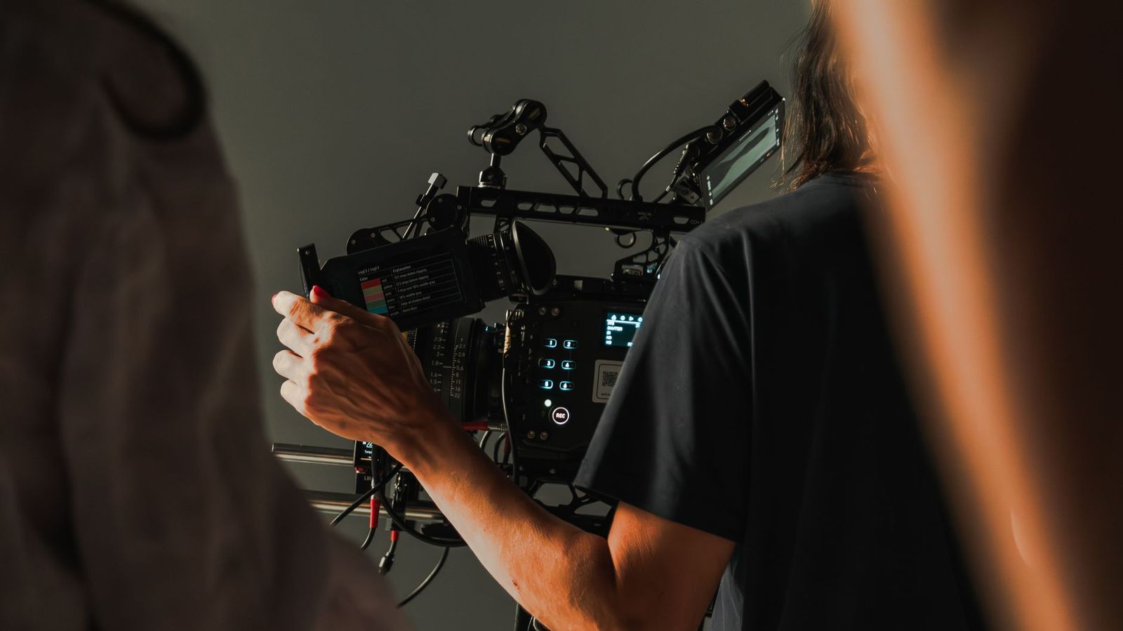 Film camera department crew member at the viewfinder
