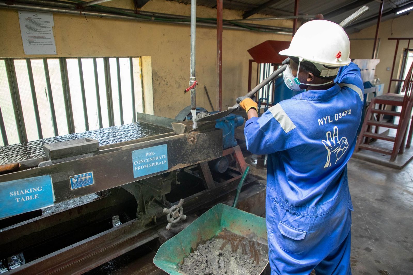 Worker inside a mineral ore processing plant