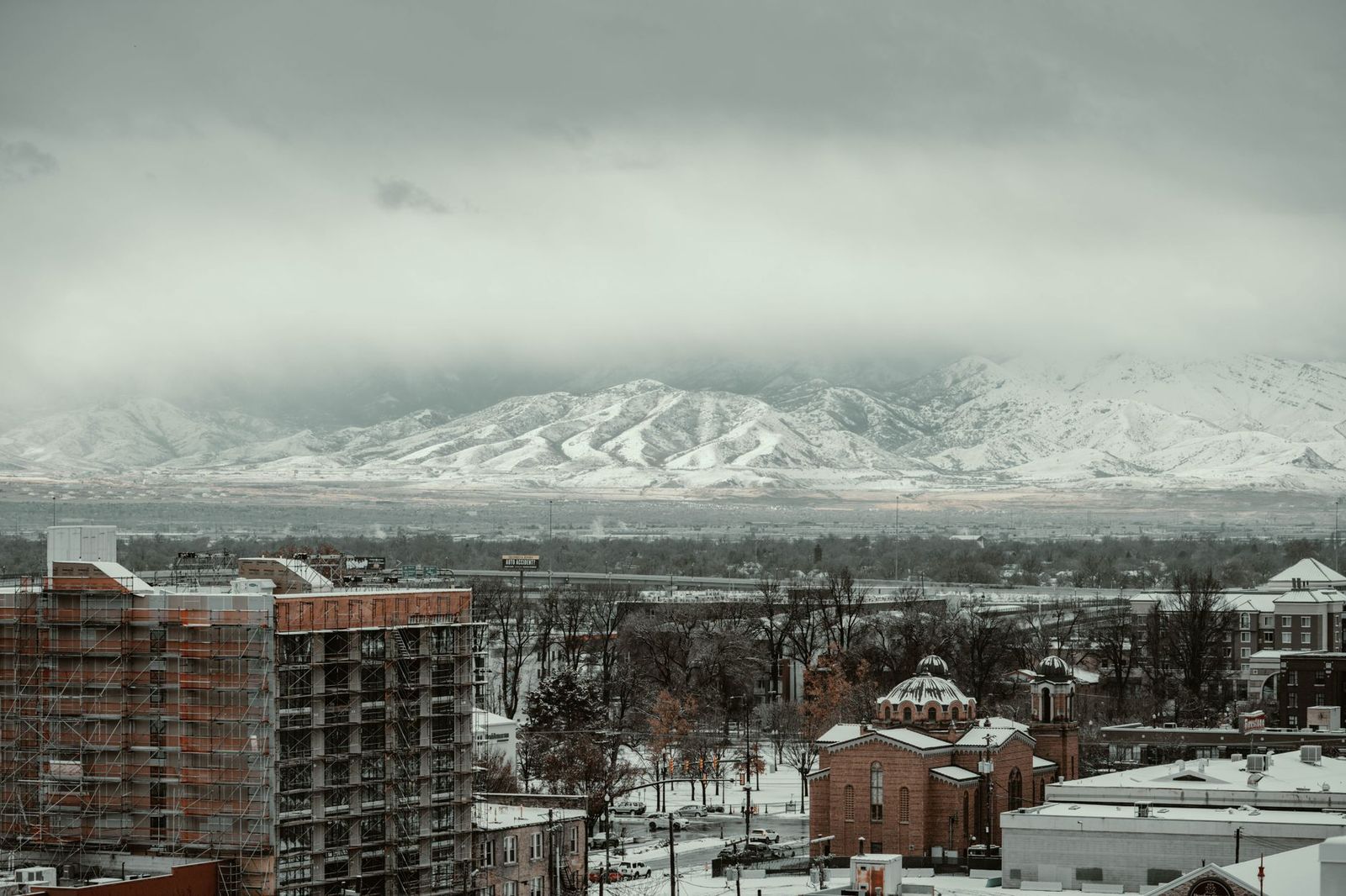 Wasatch mountains skyline over a Utah city