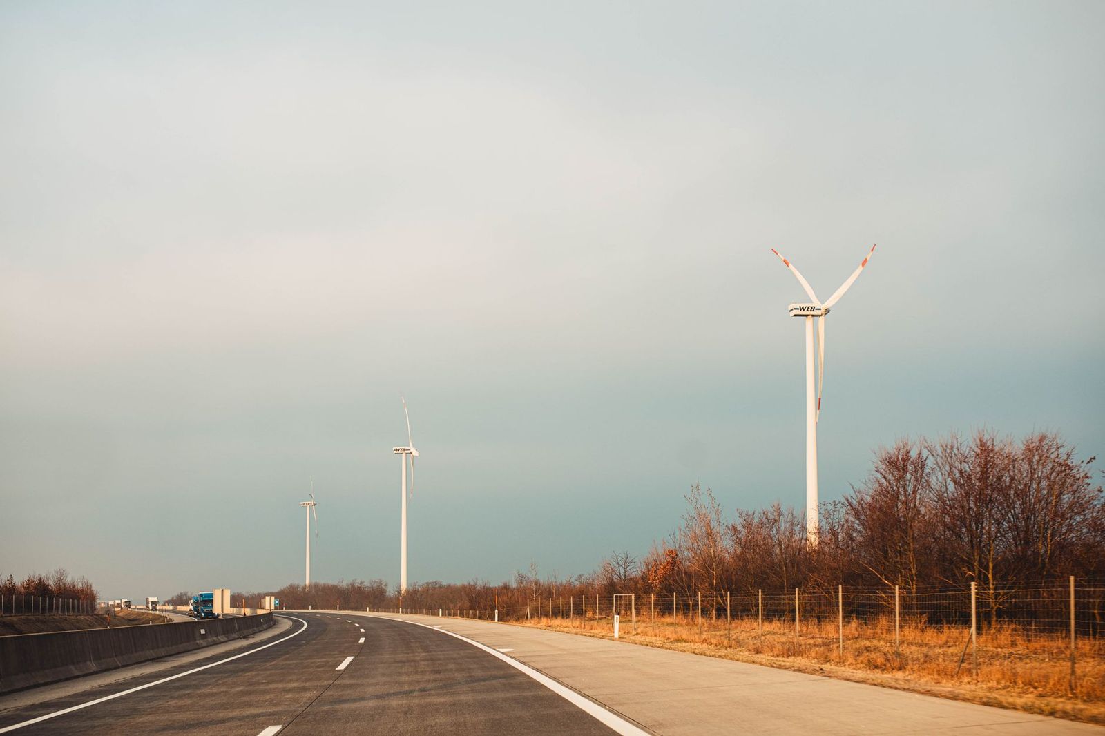 Wind turbines along a coastal highway