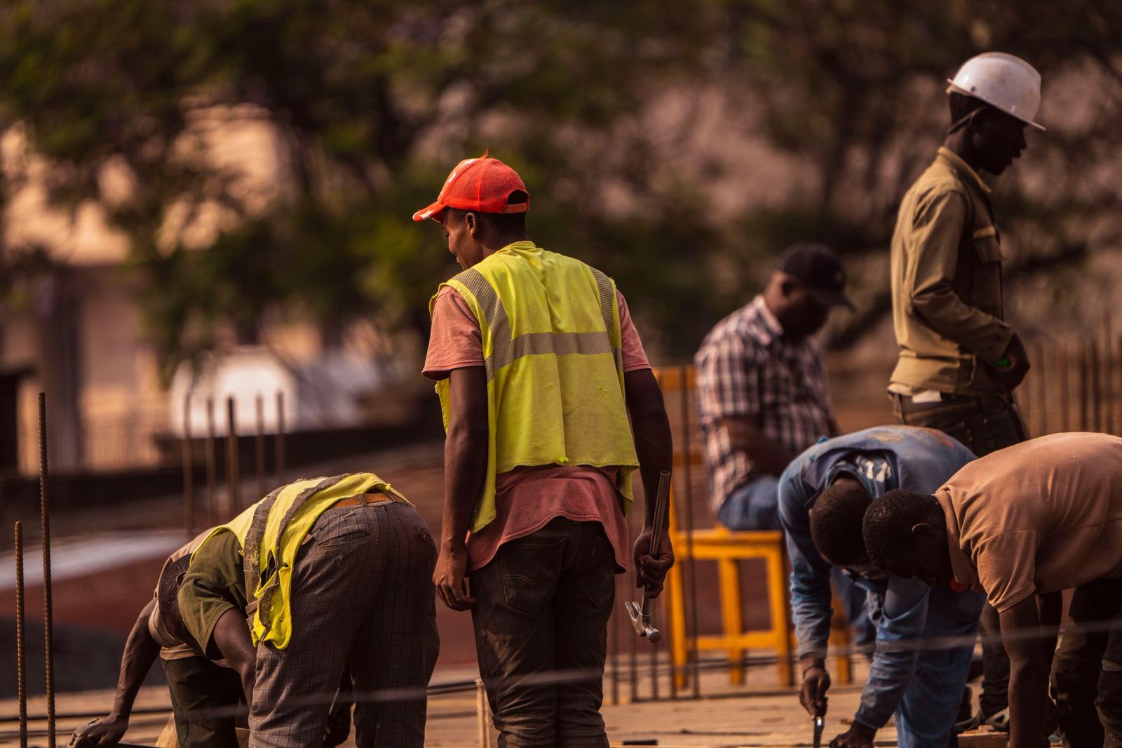 Work crew reviewing site plans at a jobsite